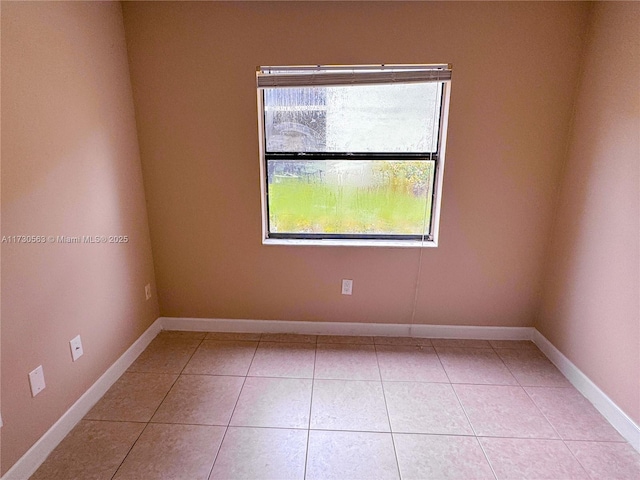 empty room featuring light tile patterned floors