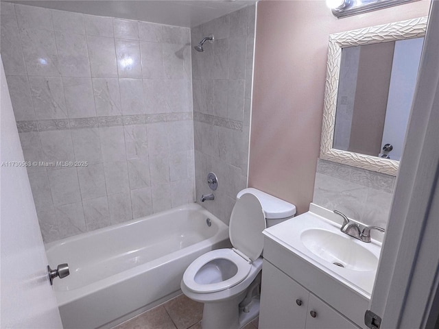 full bathroom featuring tiled shower / bath combo, vanity, toilet, and tile patterned flooring