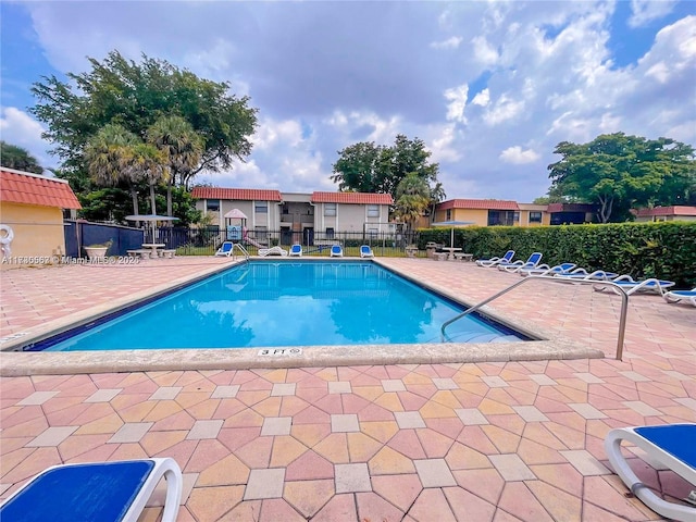 view of swimming pool with a patio area