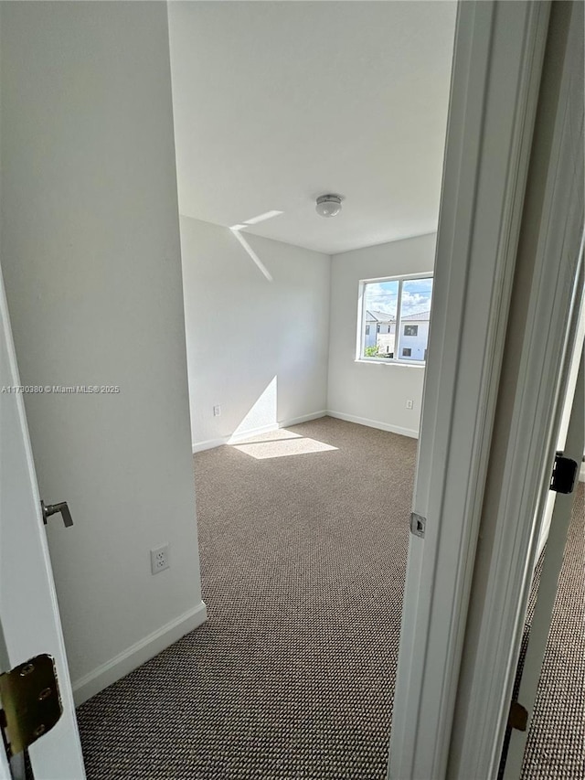 empty room featuring carpet