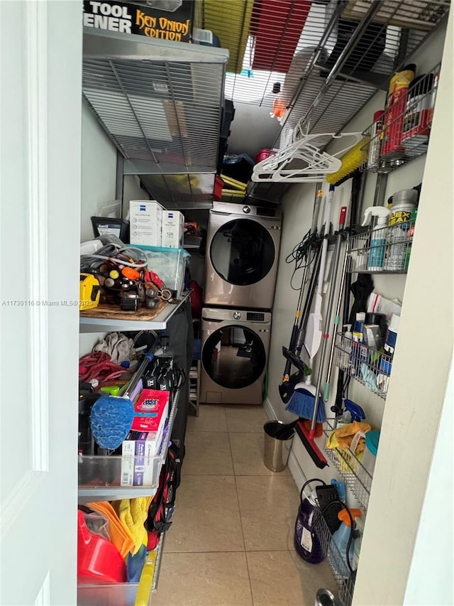 storage room with stacked washer / dryer