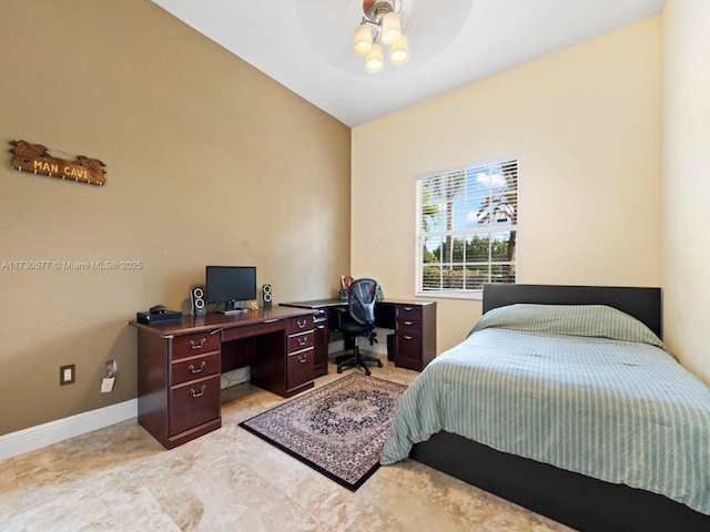 tiled bedroom featuring ceiling fan