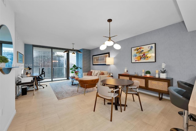 dining area featuring expansive windows and plenty of natural light