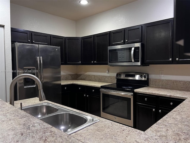 kitchen featuring appliances with stainless steel finishes and sink