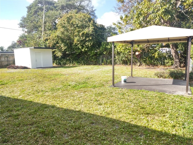 view of yard featuring a storage shed and a gazebo