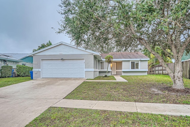 ranch-style house featuring a front yard and a garage