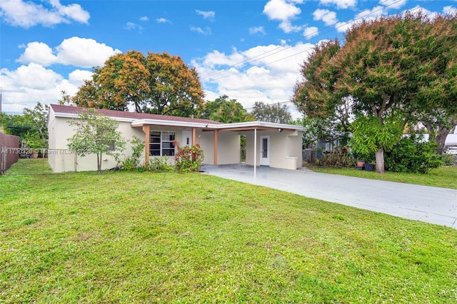 ranch-style house with a carport and a front lawn