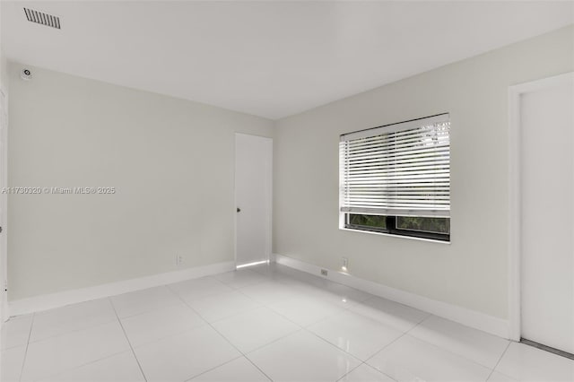 empty room featuring light tile patterned floors