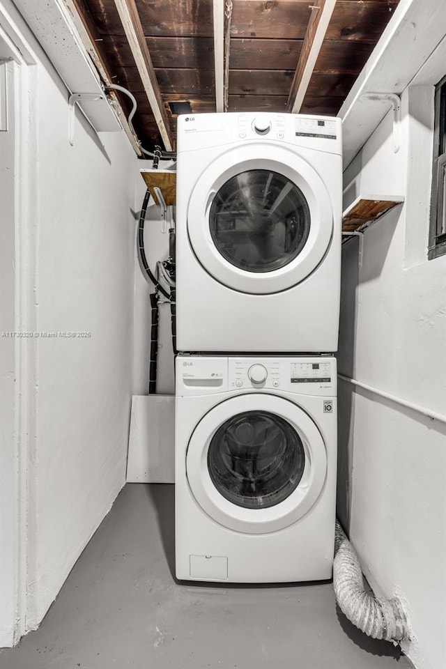 laundry room featuring stacked washer and clothes dryer