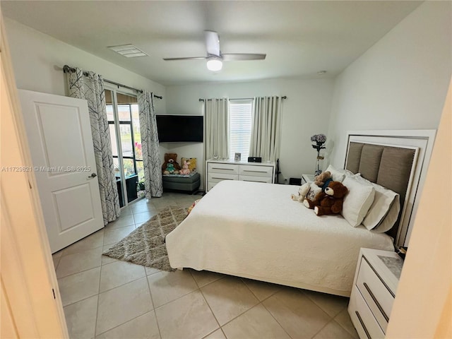 bedroom with light tile patterned floors and ceiling fan