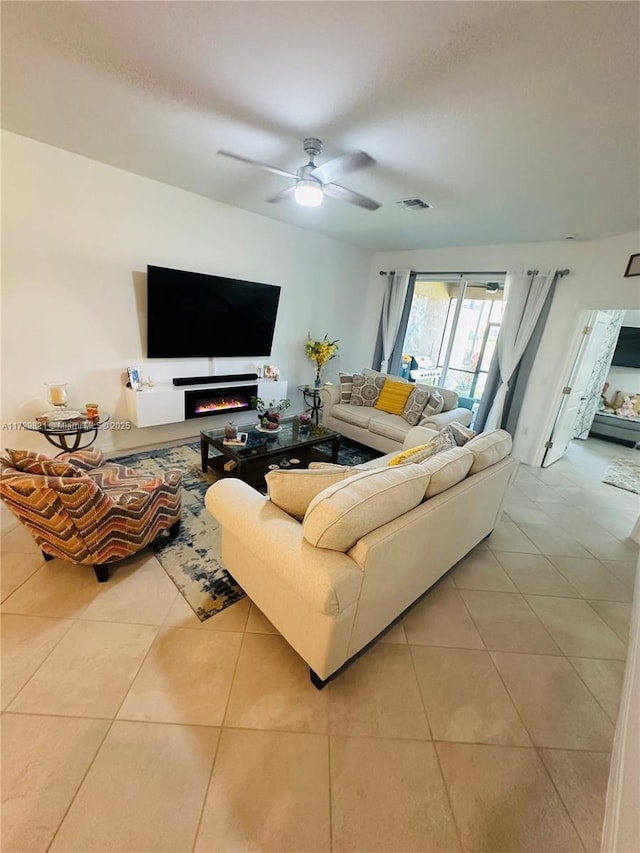 tiled living room featuring ceiling fan