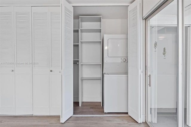 closet featuring stacked washer / drying machine