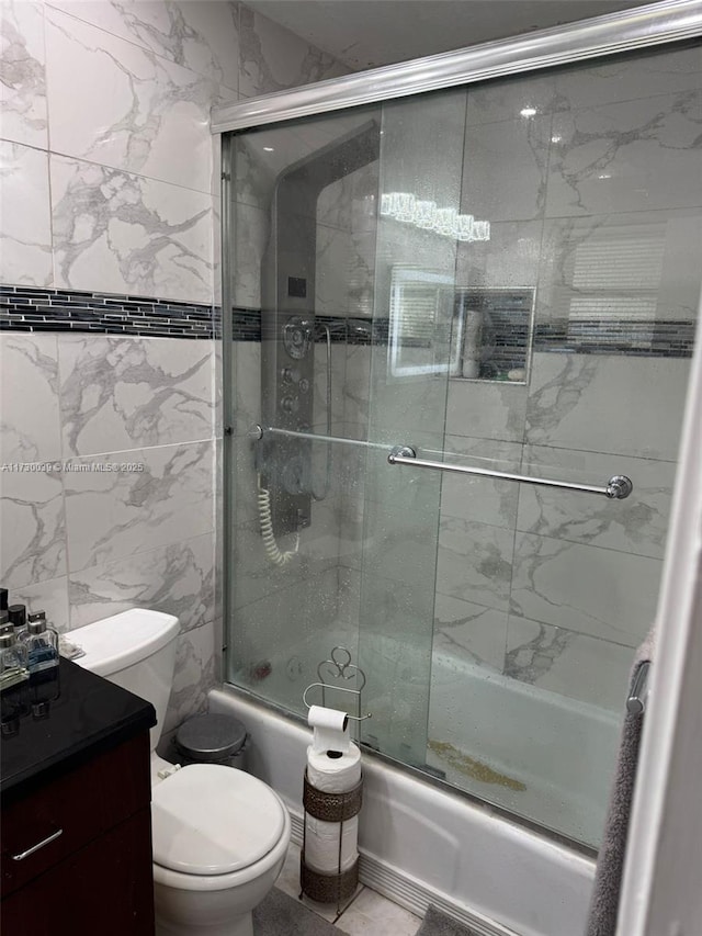 bathroom featuring toilet, enclosed tub / shower combo, and tile walls