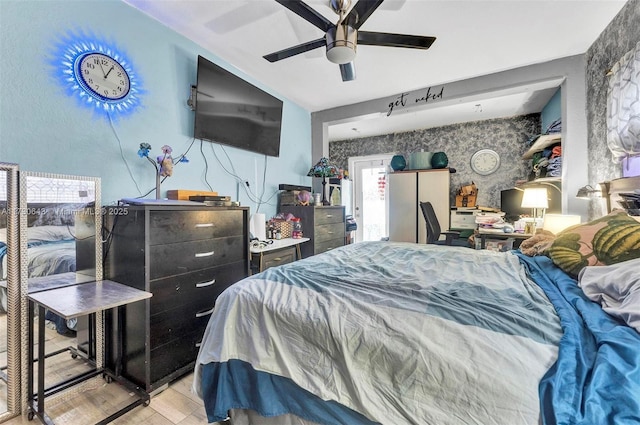 bedroom with ceiling fan and light hardwood / wood-style floors