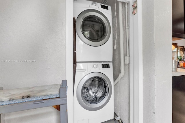 laundry room with stacked washer and clothes dryer