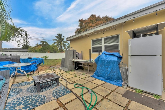 view of patio featuring a fire pit