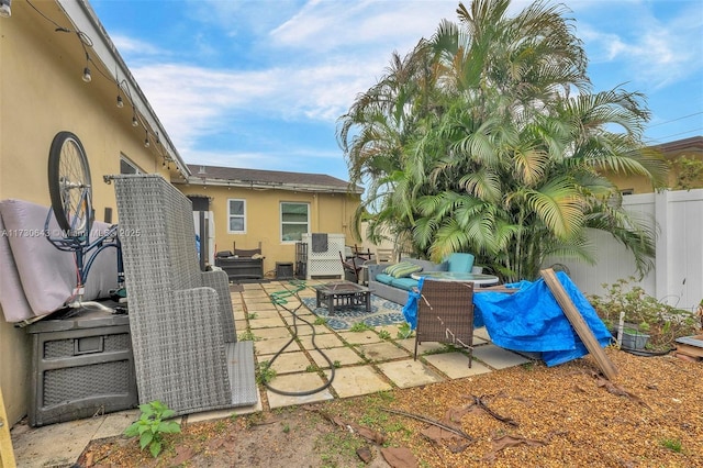 view of patio with an outdoor fire pit