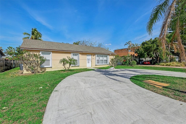 ranch-style house with a front lawn