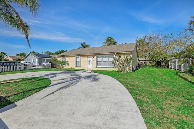 ranch-style house with a front yard