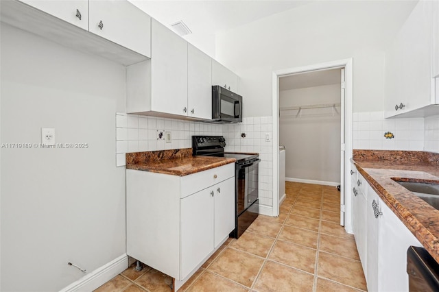 kitchen featuring black appliances, white cabinets, decorative backsplash, and light tile patterned flooring