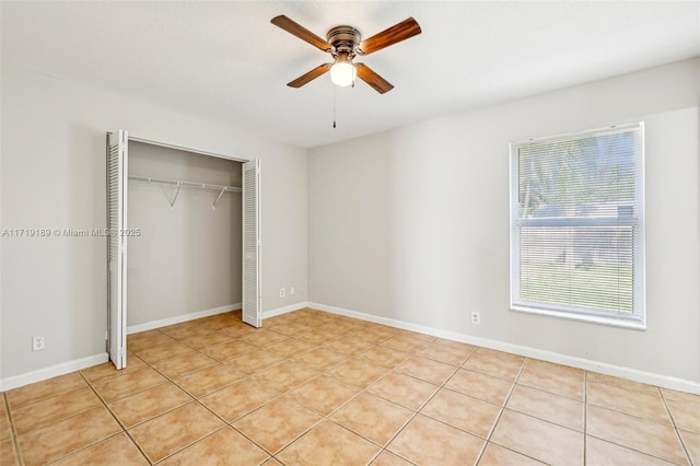 unfurnished bedroom featuring a closet, ceiling fan, and light tile patterned floors