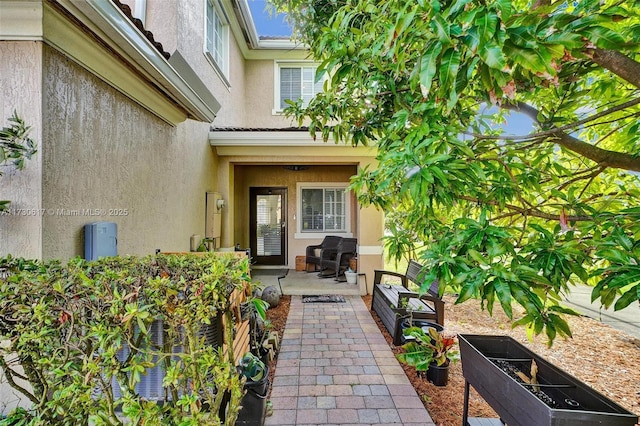 entrance to property with a patio area