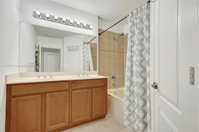 bathroom featuring vanity, tile patterned floors, and shower / tub combo with curtain