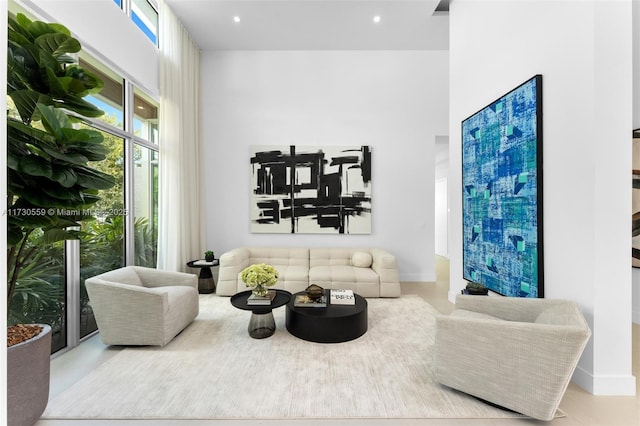 living room with a high ceiling