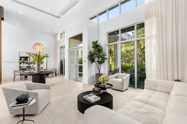 living room featuring a high ceiling