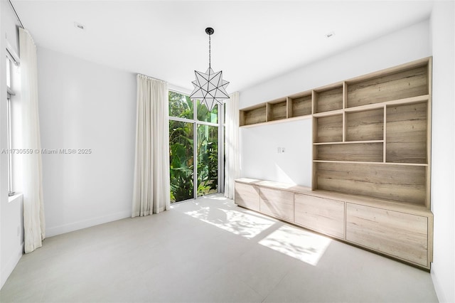 mudroom with a chandelier