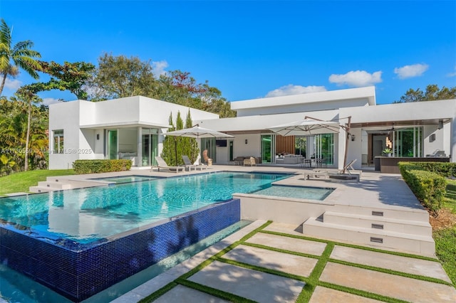 rear view of house featuring a patio