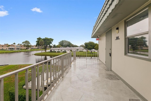 balcony featuring a water view