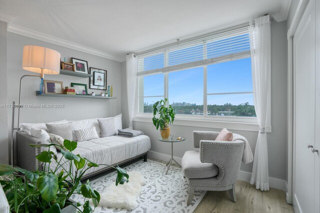 living room featuring hardwood / wood-style flooring and ornamental molding