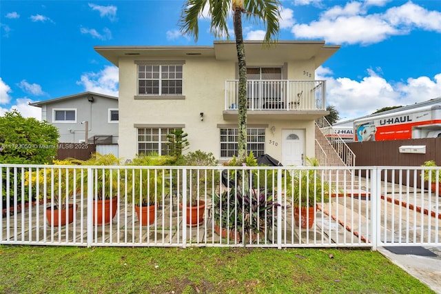 view of front of house with a balcony