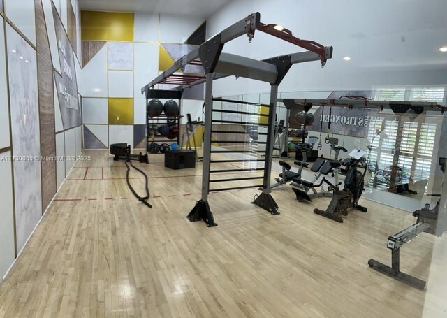 exercise room featuring hardwood / wood-style flooring