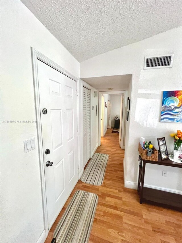 walk in closet featuring hardwood / wood-style floors