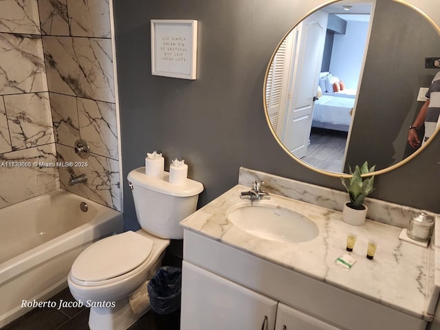 bathroom featuring toilet, shower / washtub combination, connected bathroom, and vanity