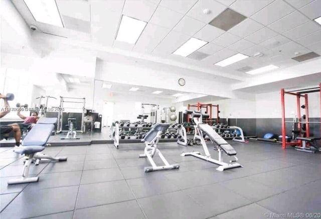 workout area featuring a paneled ceiling