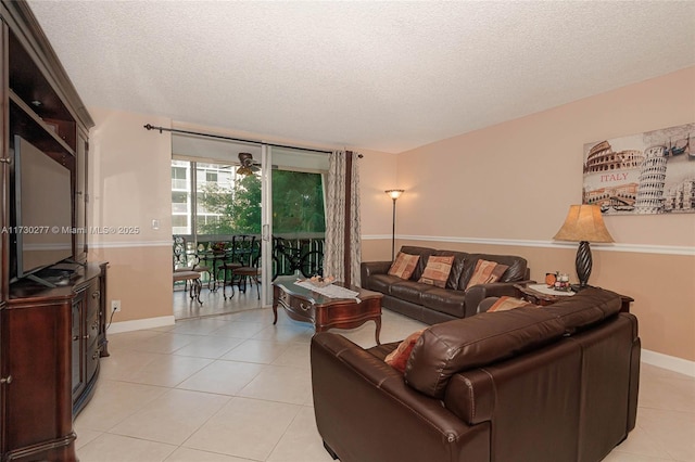 tiled living room featuring a textured ceiling