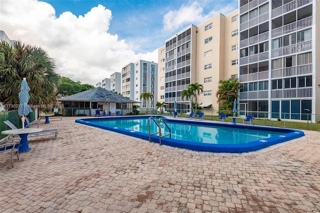 view of pool featuring a patio