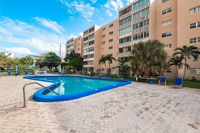 view of swimming pool with a patio