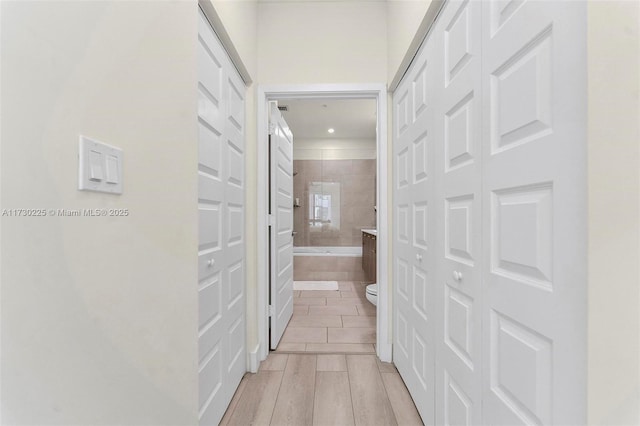 corridor featuring light hardwood / wood-style floors