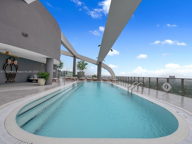 view of swimming pool featuring a patio area