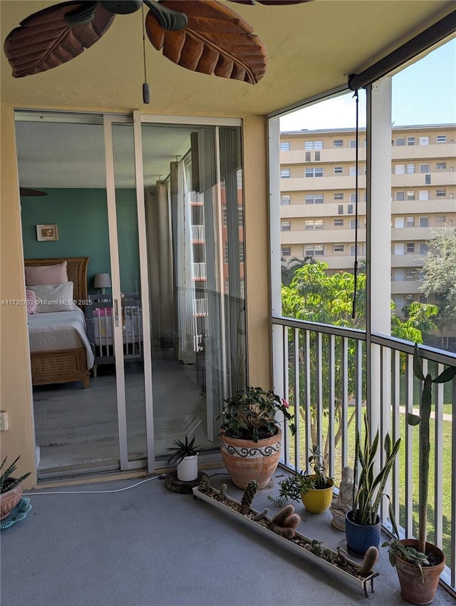 balcony featuring ceiling fan