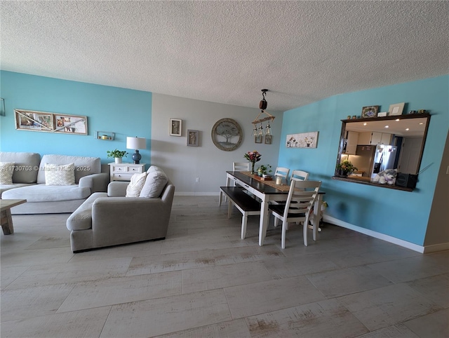 dining area featuring a textured ceiling