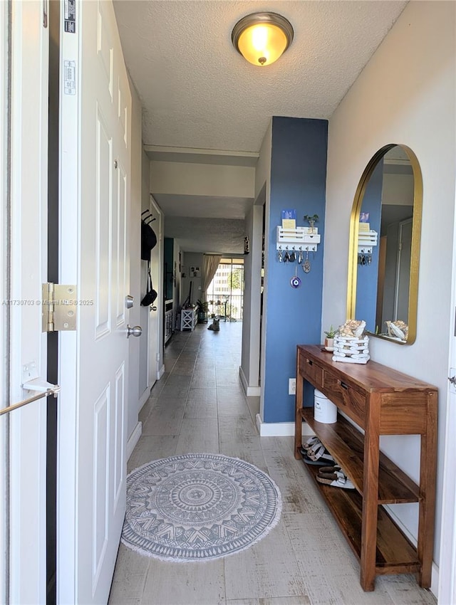 hallway featuring a textured ceiling