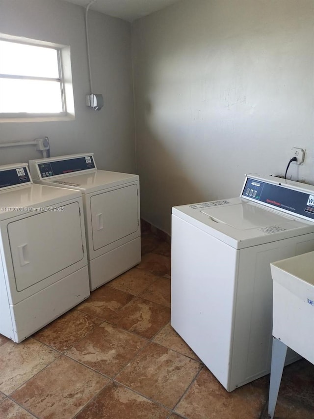 laundry area with sink and washer and dryer