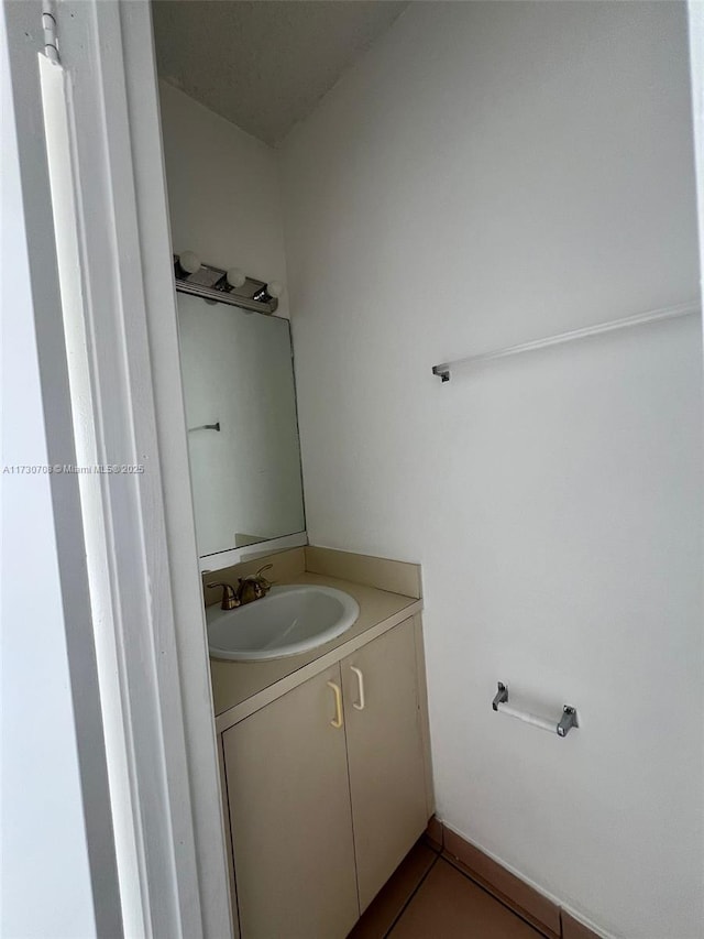 bathroom featuring tile patterned floors and vanity