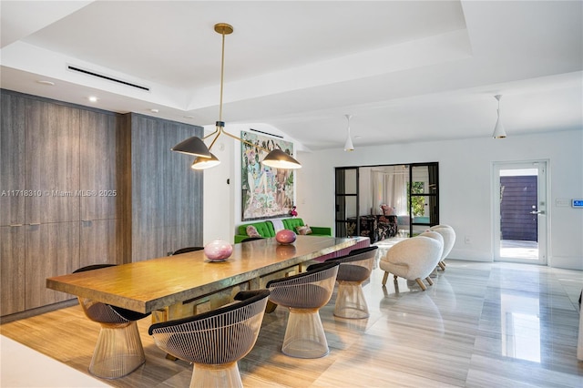 dining area featuring a tray ceiling