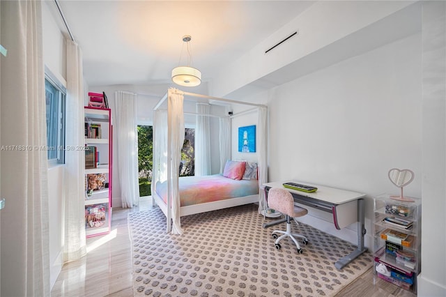 bedroom featuring vaulted ceiling